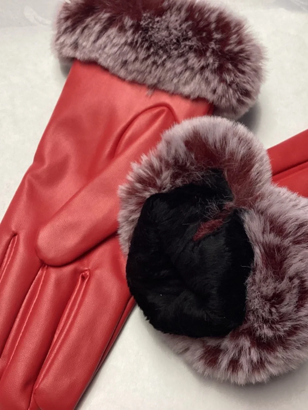 Red winter gloves with PURPLE FAUX FUR. really cute. Non leather